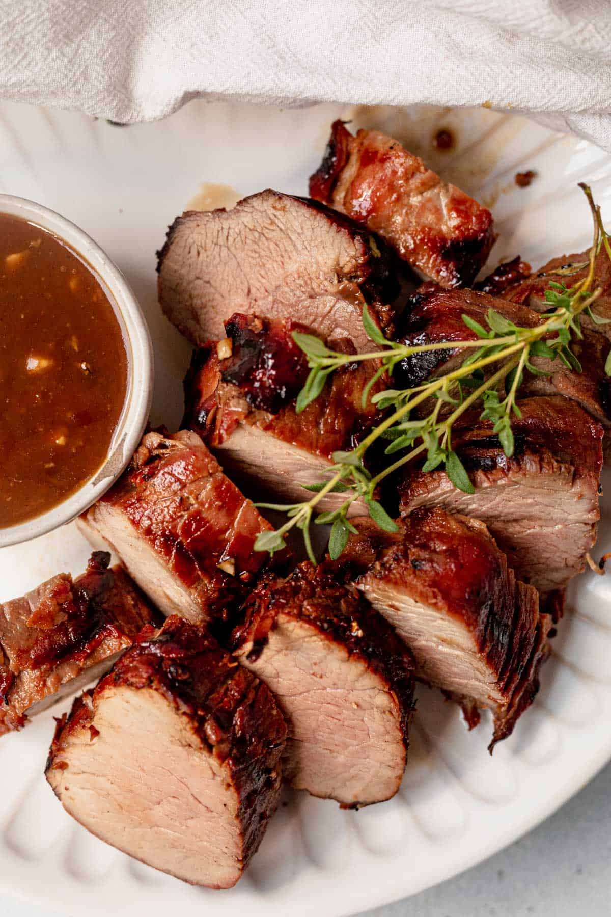 grilled and sliced pork tenderloin on a plate