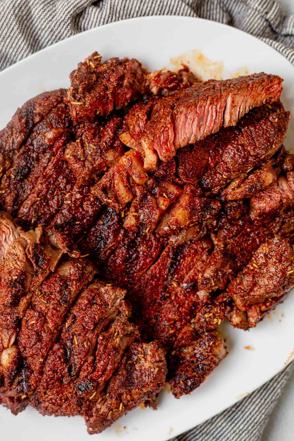 a plate of grilled and sliced steak