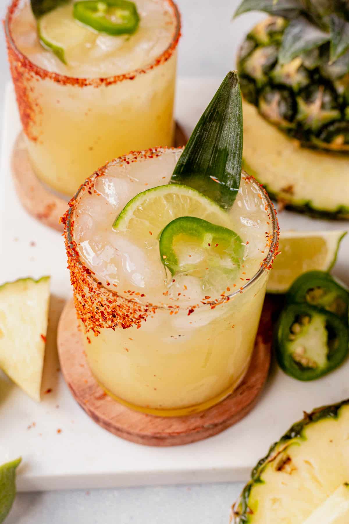 jalapeno and a pineapple leaf in a pineapple margarita