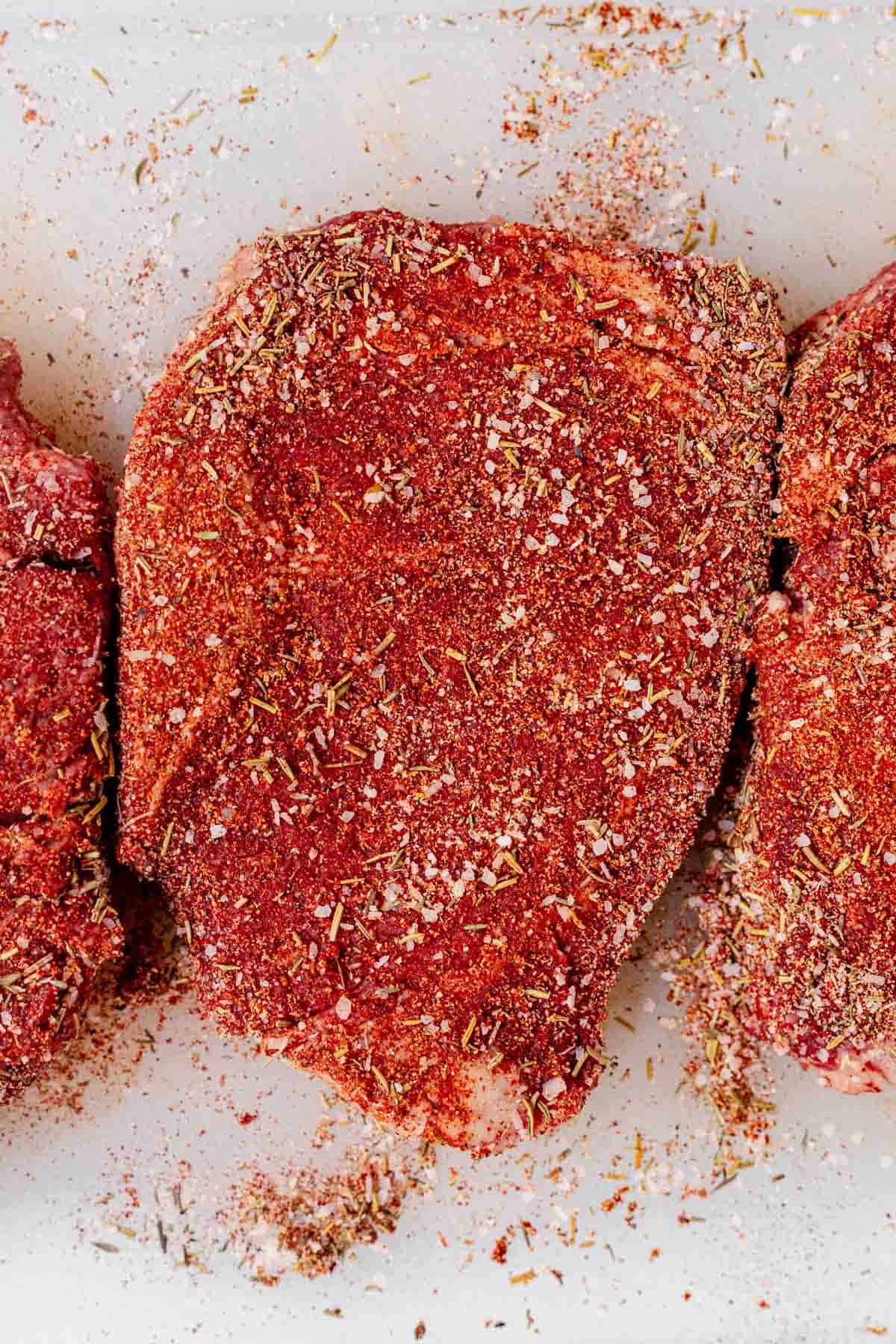 steak seasoning rubbed all over raw ribeye