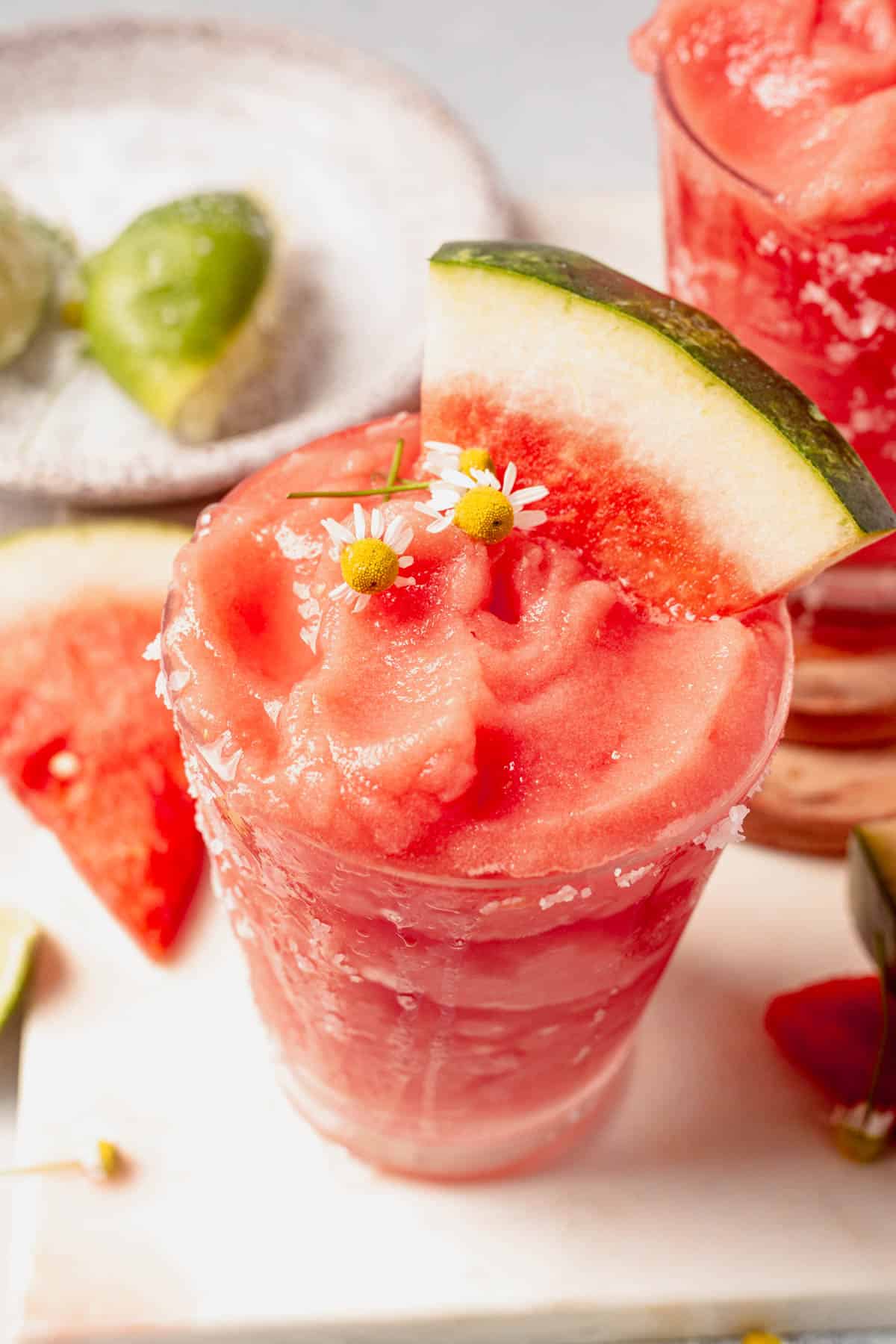 two glasses of frozen watermelon margaritas