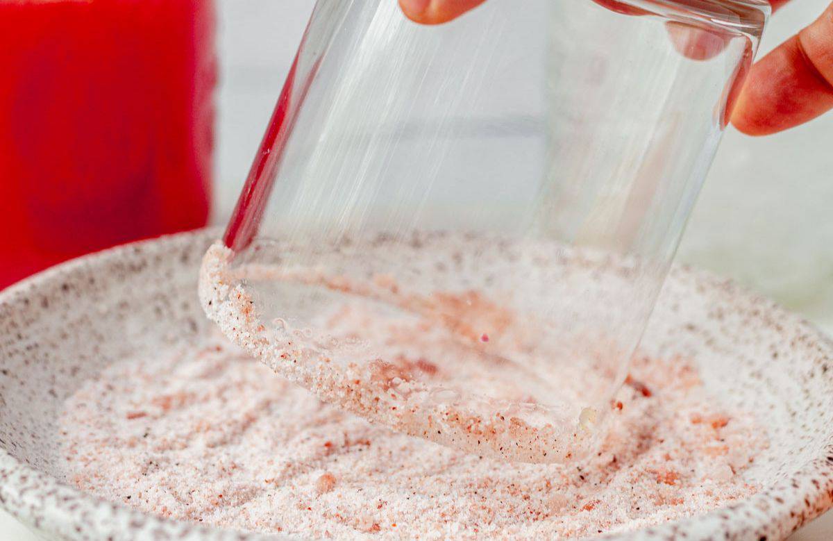 dipping the rim of a glass into salt