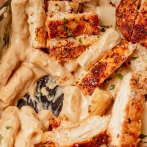 garlic parmesan chicken pasta in a cast iron skillet