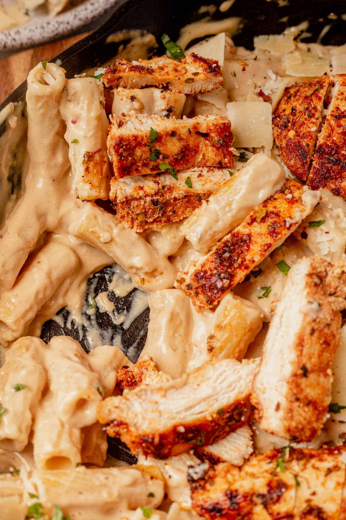 garlic parmesan chicken pasta in a cast iron skillet