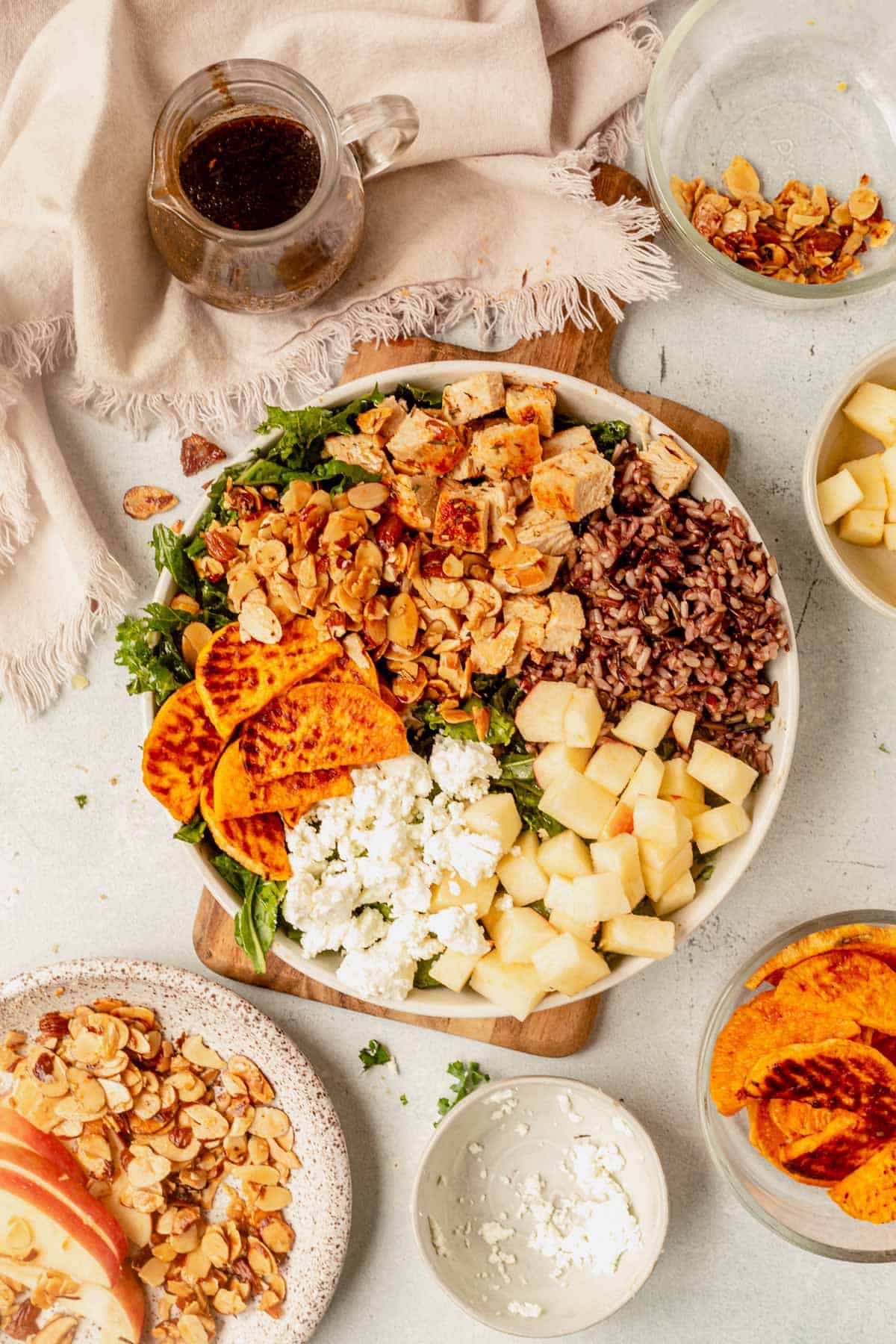 harvest bowl with rice, apples, chicken, sweet potatoes, and goat cheese