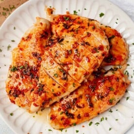 juicy baked chicken breasts on a plate