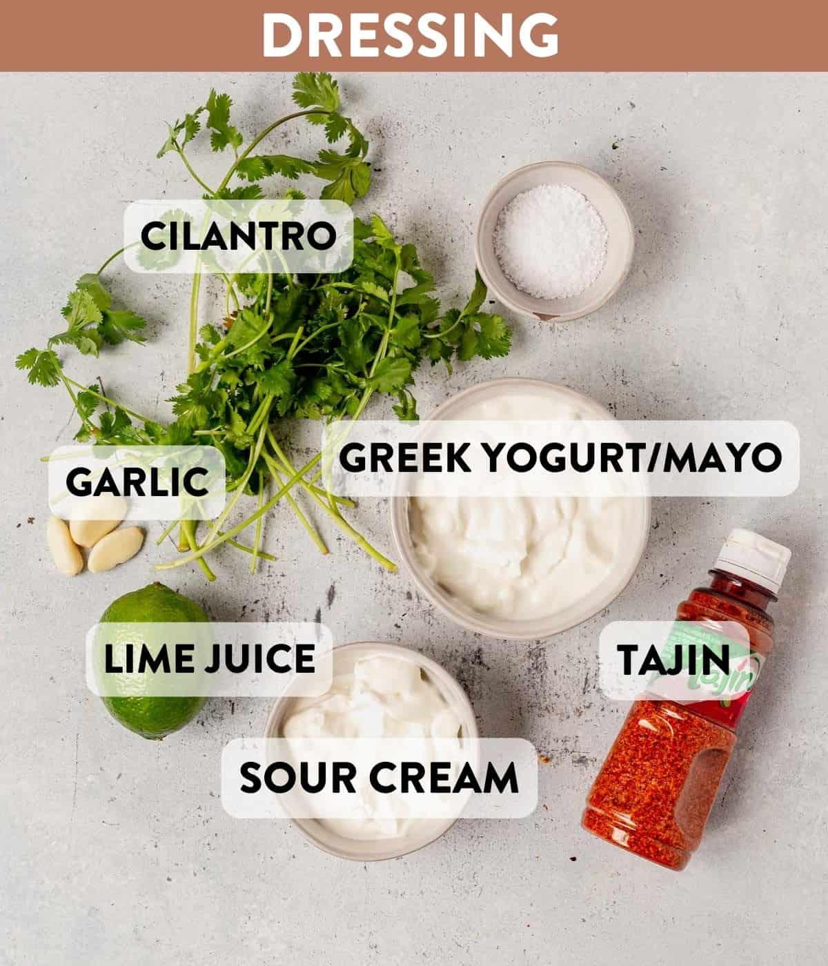 cilantro, yogurt, sour cream, lime, garlic, and tajin on a table