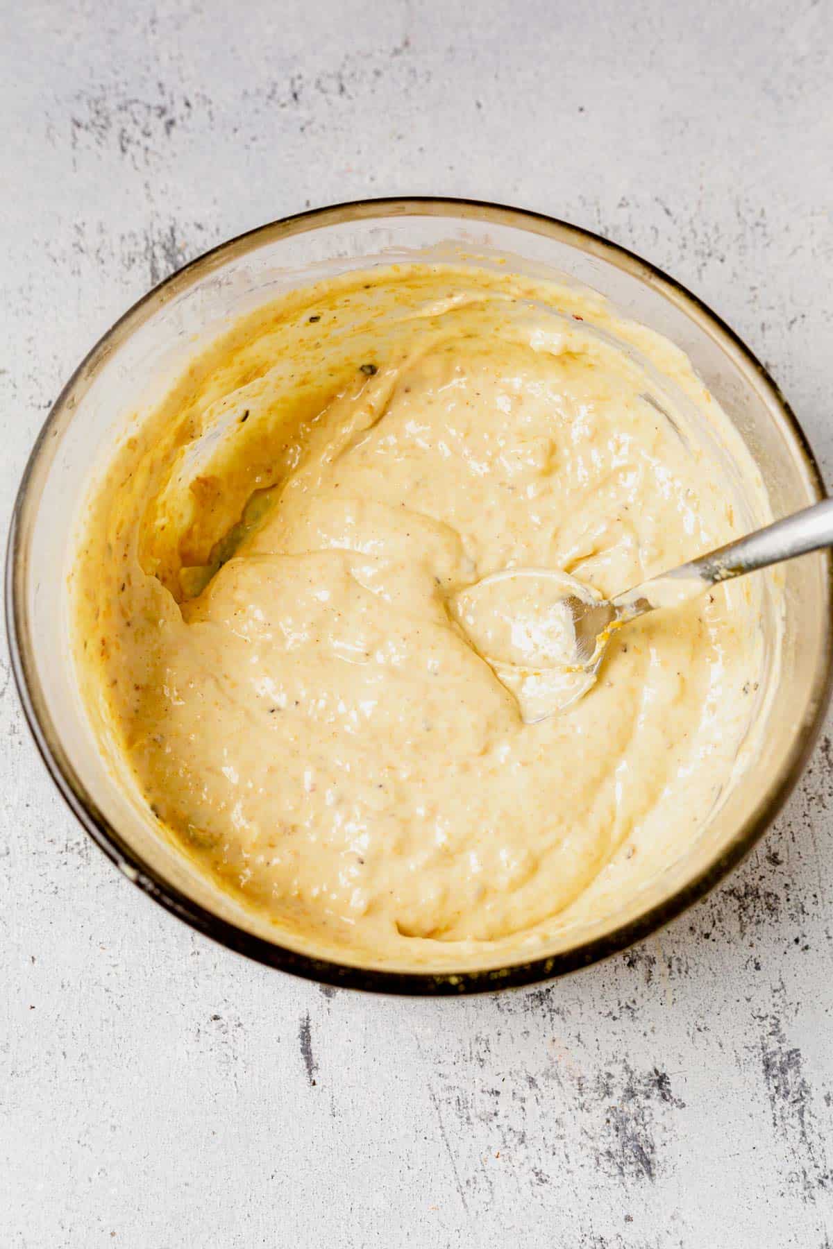 homemade Caesar dressing in a bowl.