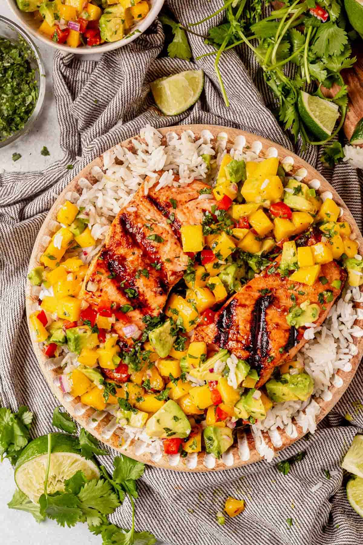 grilled salmon with mango salsa on top of rice