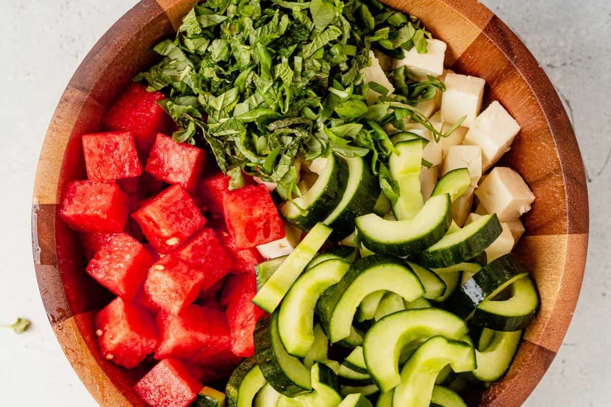 watermelon basil salad ingredients in a bowl