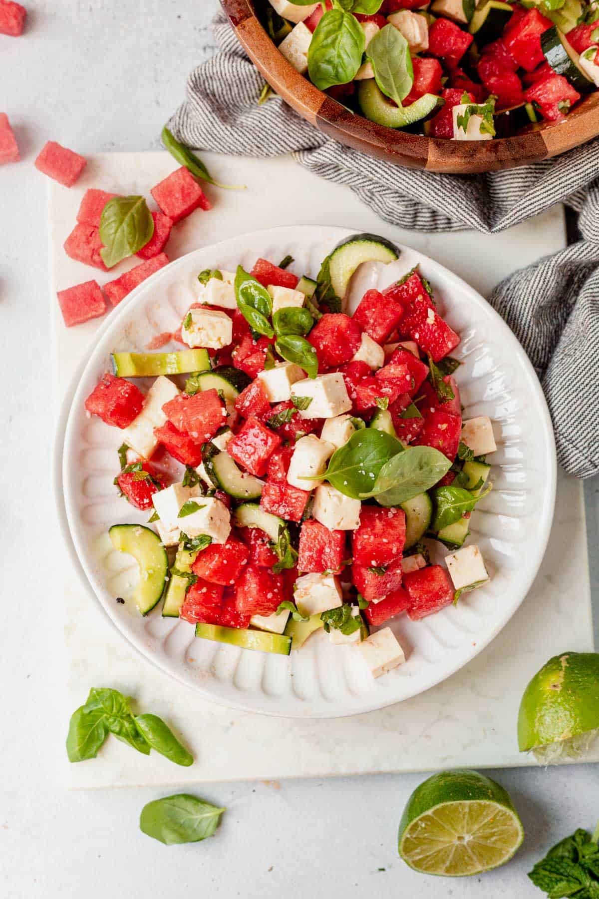 a plate of watermelon basil salad