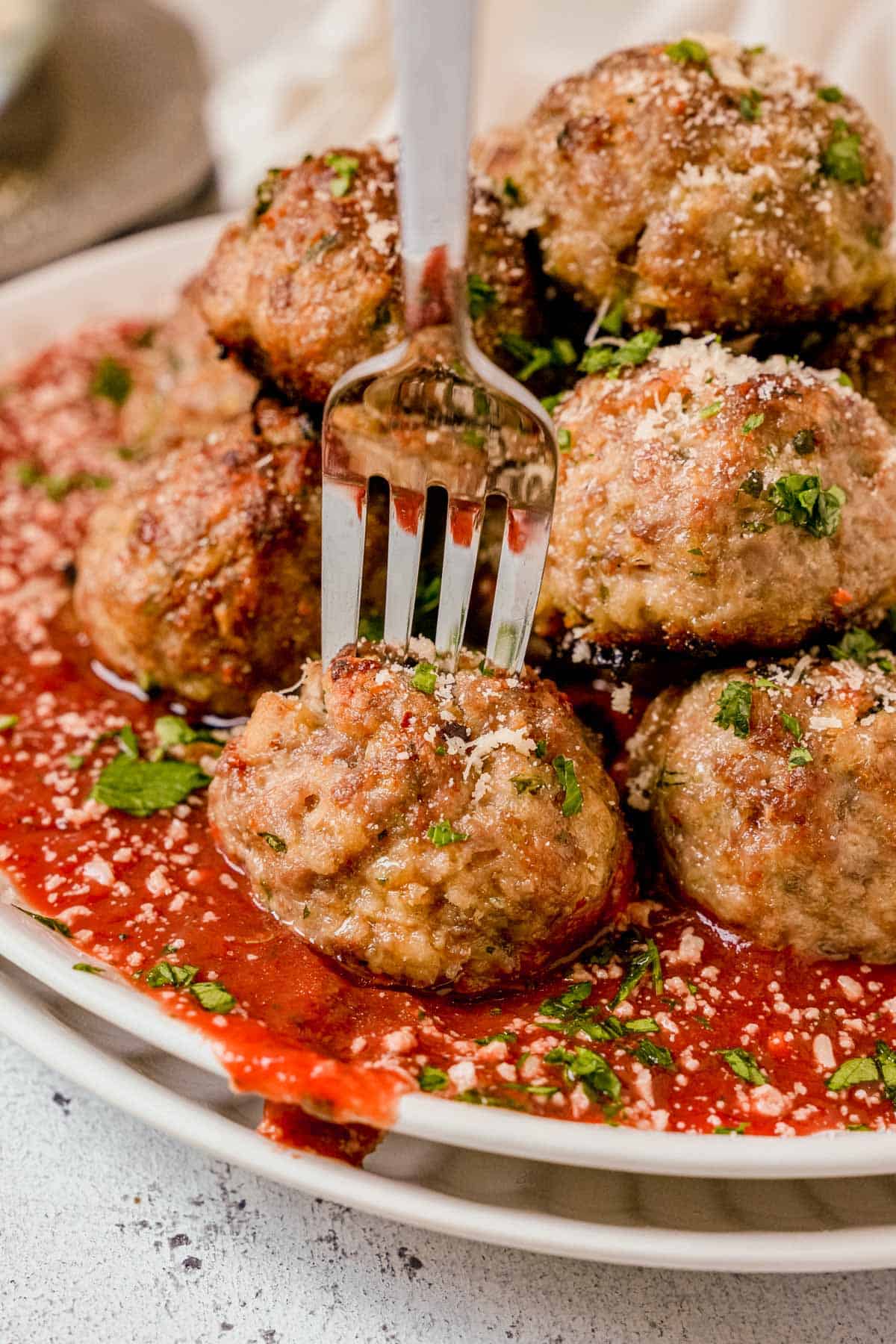 baked italian meatball on a fork