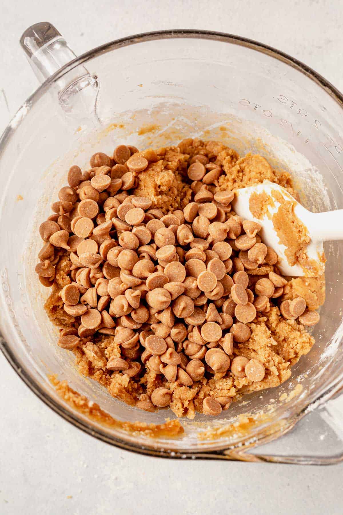 peanut butter cookie dough with peanut butter chips in a bowl.