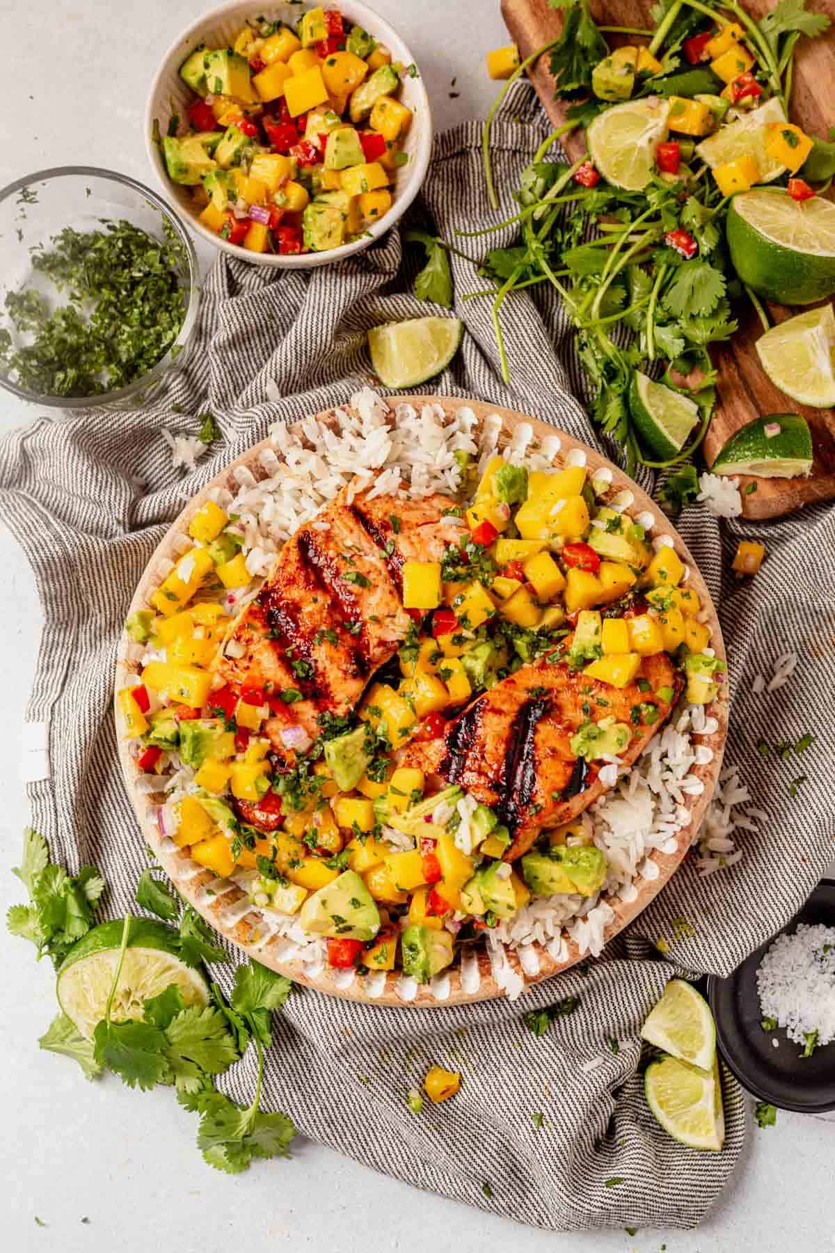 grilled salmon with mango salsa on top of coconut rice