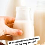 hand grabbing a glass jar of oat milk