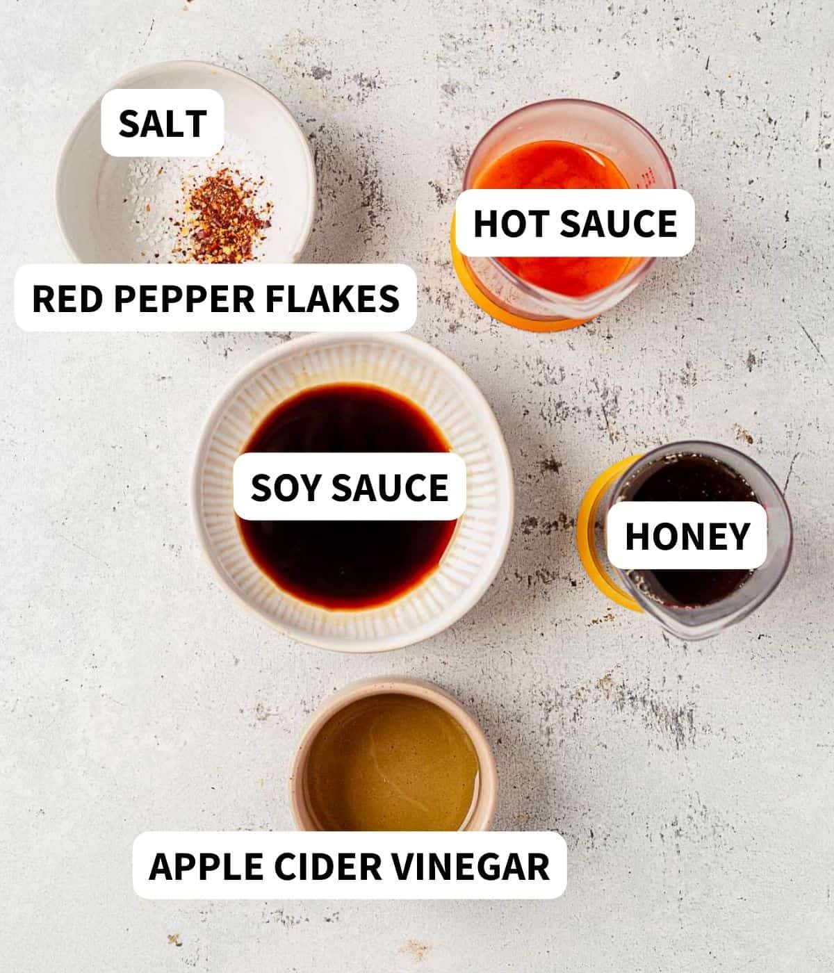hot sauce, soy sauce, vinegar, and maple syrup on a countertop
