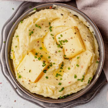 boursin mashed potatoes in a bowl with butter