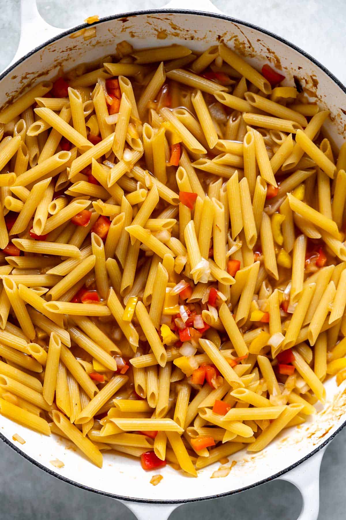 pasta and peppers in a pot.