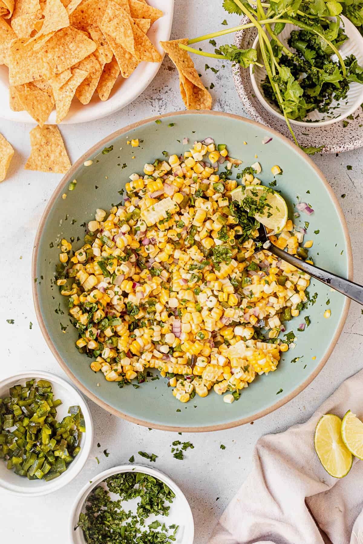 chipotle corn salsa with fresh cilantro, chips, and poblano peppers