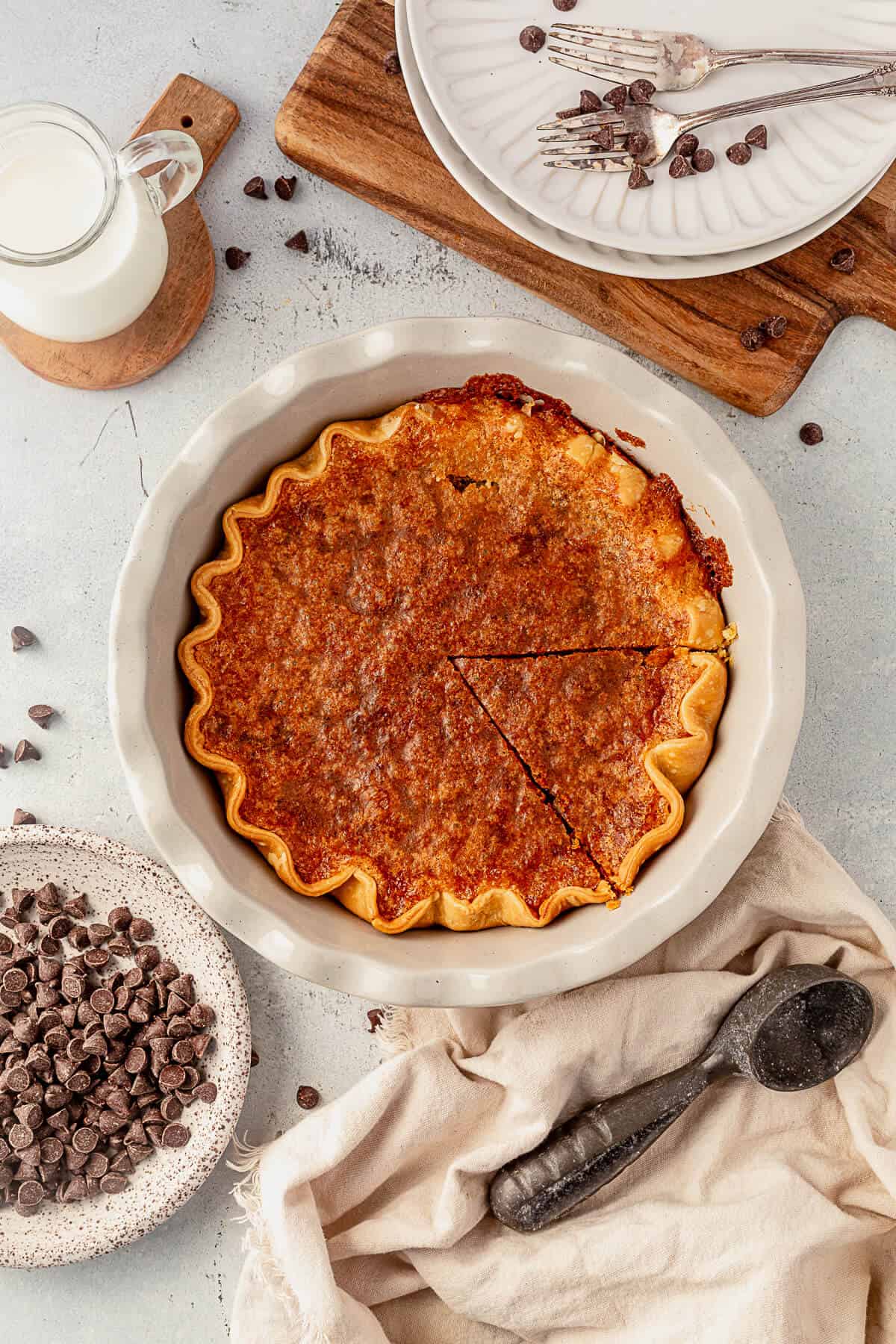 freshly baked chocolate chip pie with one triangle cut