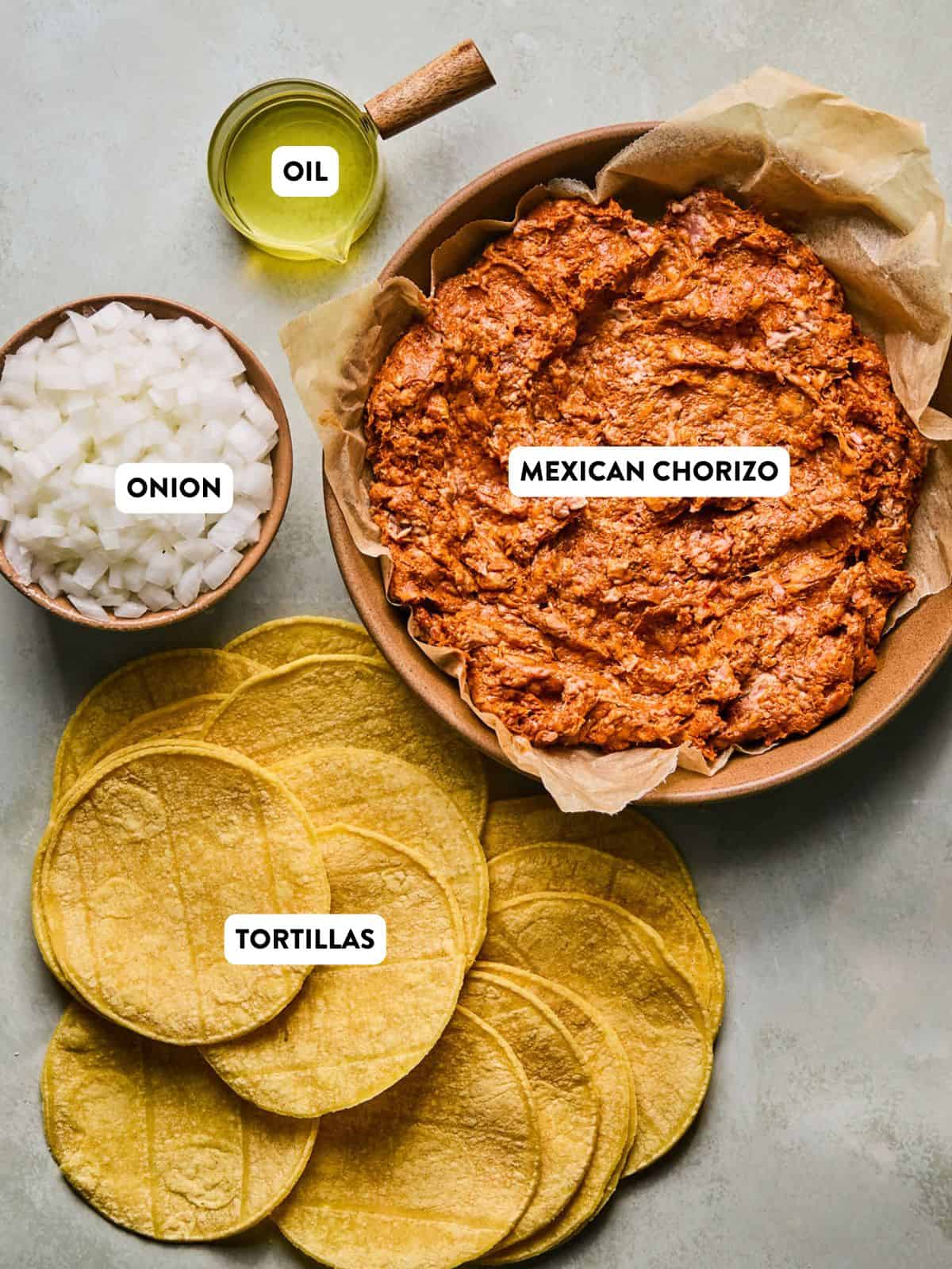 ingredients for chorizo tacos on a counter.