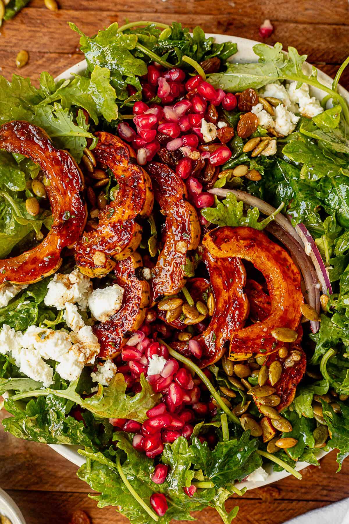 golden brown roasted delicata squash salad in a serving bowl