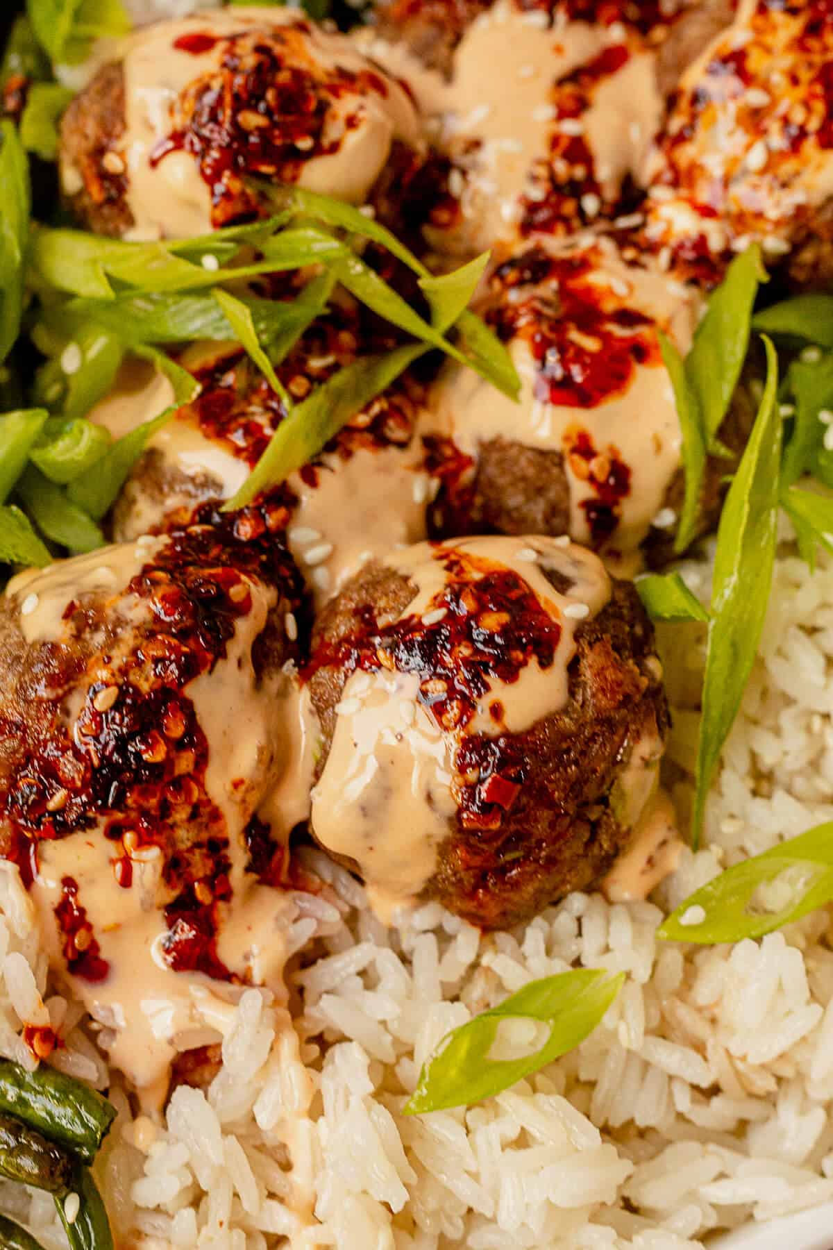 crispy baked firecracker meatballs with sauce and rice