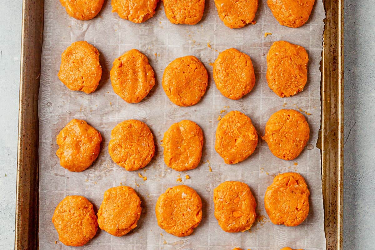 healthy chicken nuggets on a cookie sheet before baking