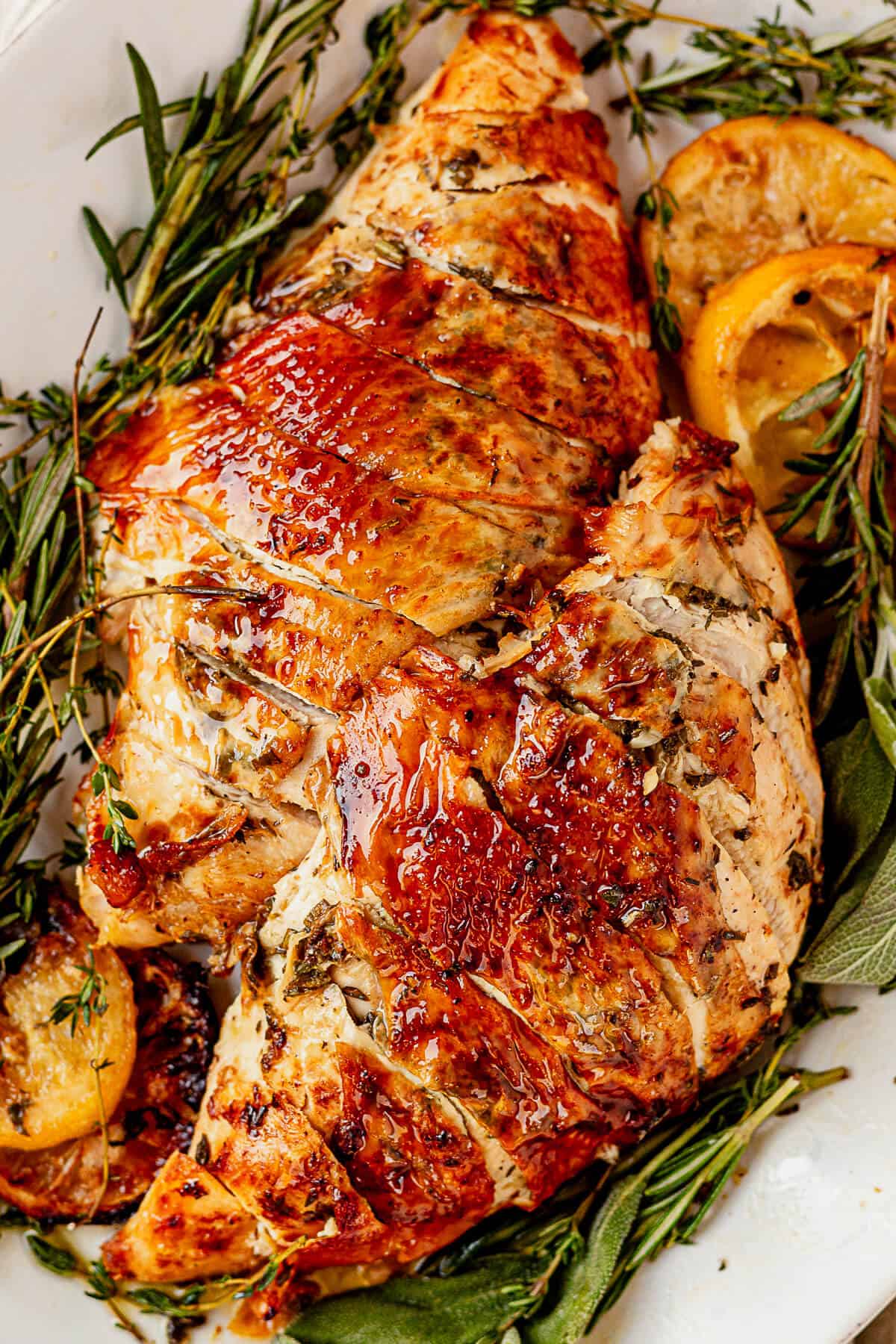 two crispy roasted turkey breasts with herbs