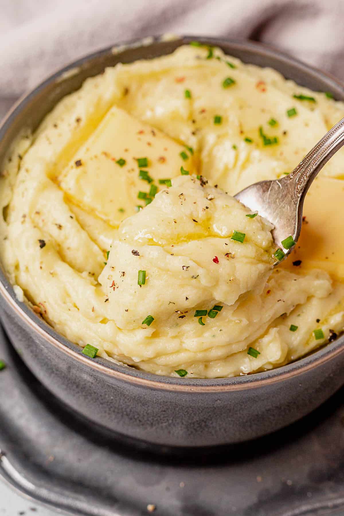 scooping mashed potatoes onto a fork