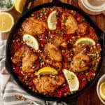 one pan spanish chicken and rice with lemon wedges