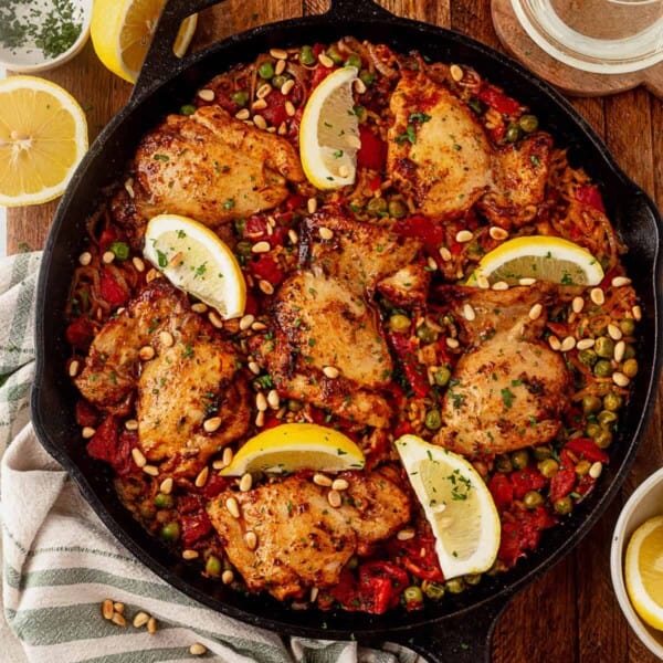 one pan spanish chicken and rice with lemon wedges