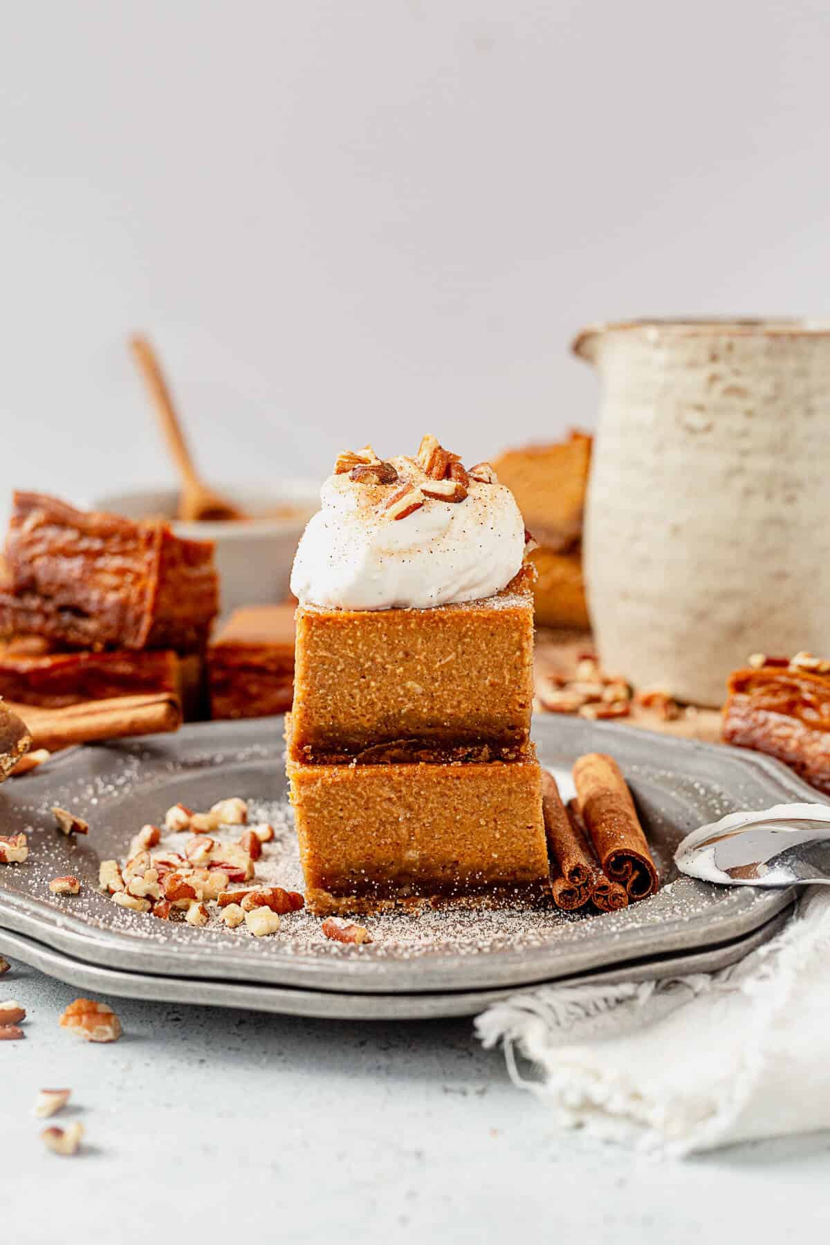 two pumpkin pie bars on a serving plate