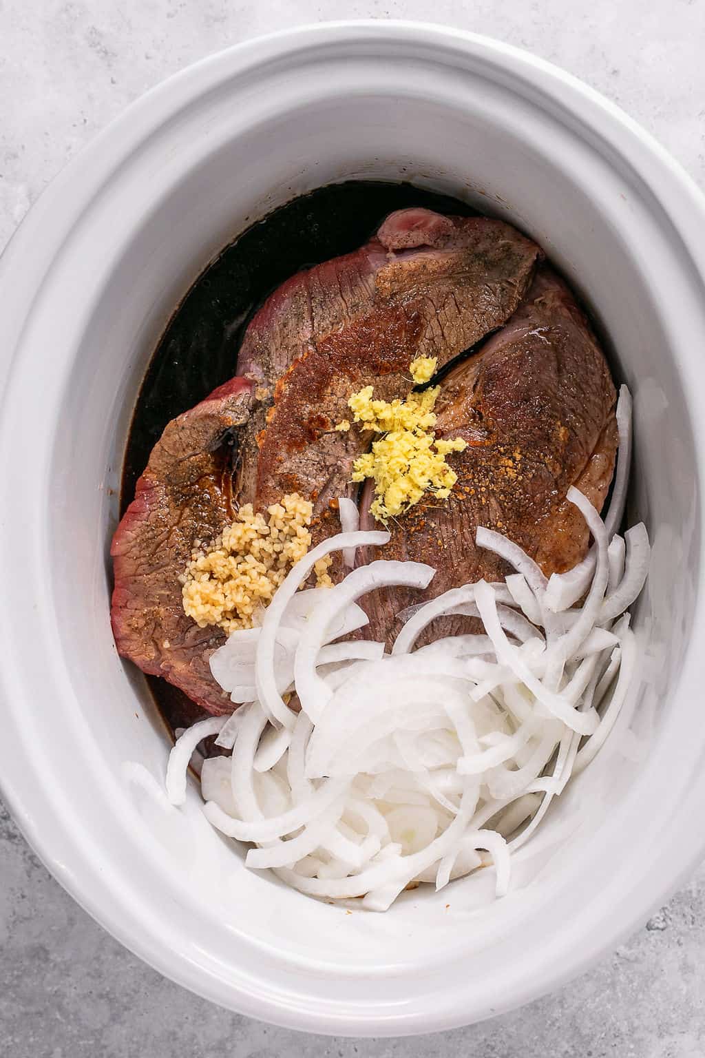 beef and korean sauce ingredients in a slow cooker