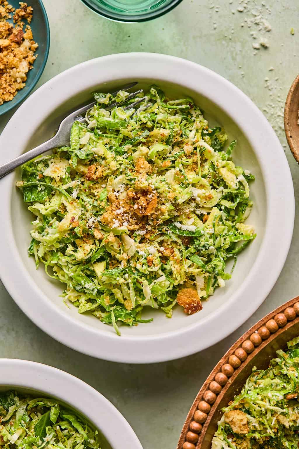 brussel sprout caesar salad on a plate.