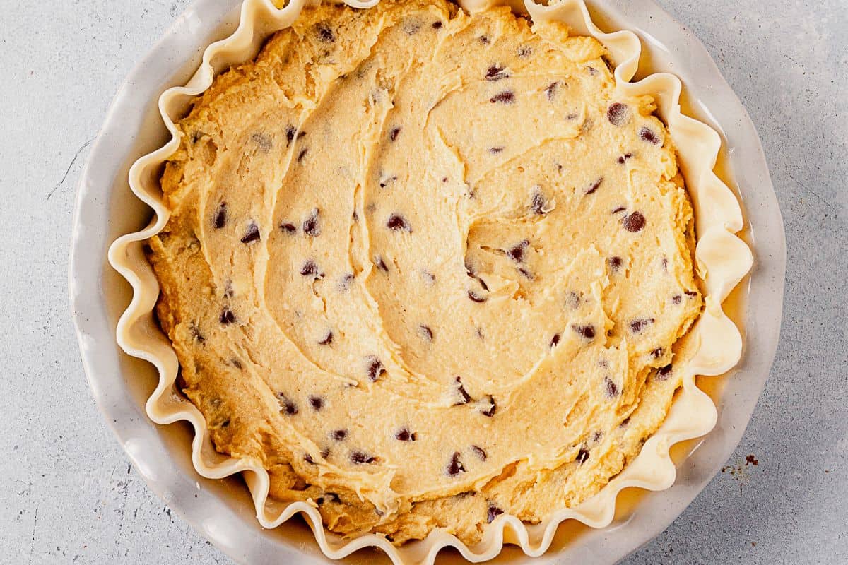 chocolate chip pie dough inside an unbaked pie shell