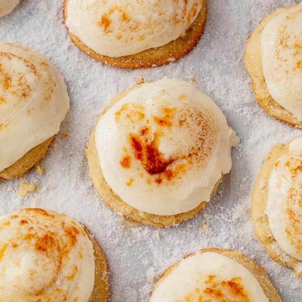 creme brulee cookies on parchment paper with sugar
