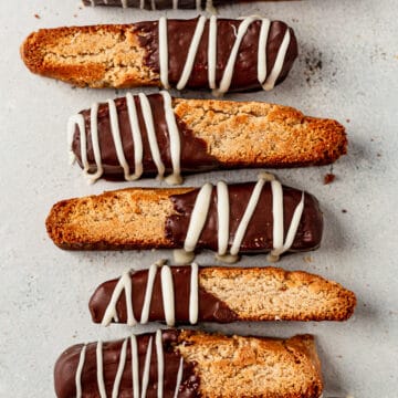 gluten free biscotti dipped in chocolate on a countertop