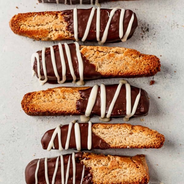 gluten free biscotti dipped in chocolate on a countertop
