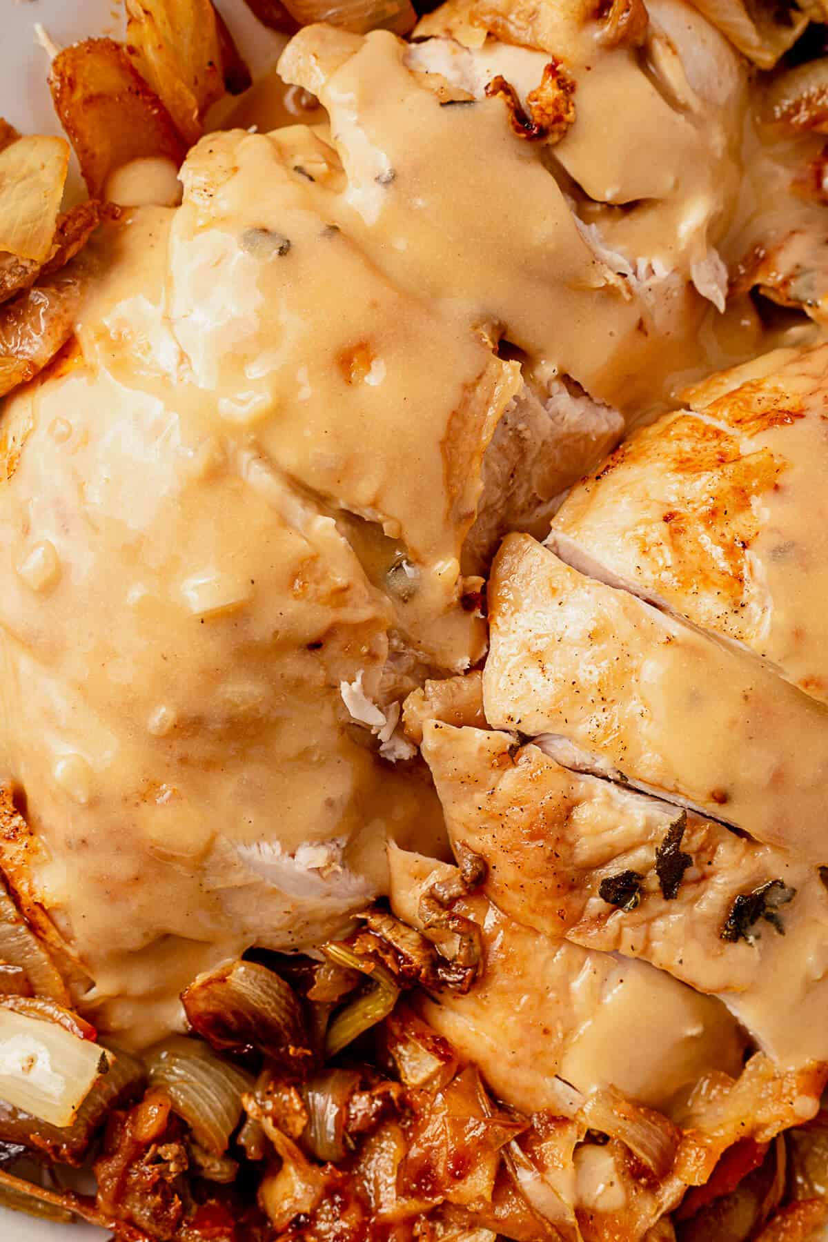 two roasted turkey breasts covered in gluten free gravy