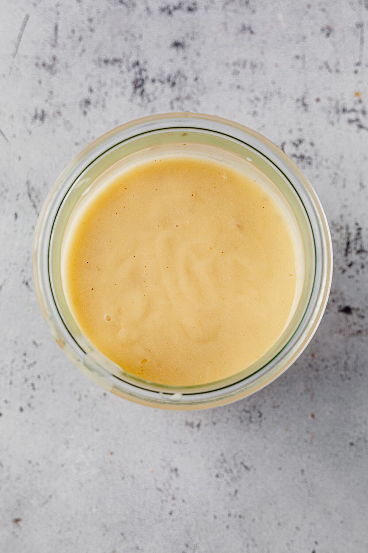 a roux for gravy cooling in a glass jar.