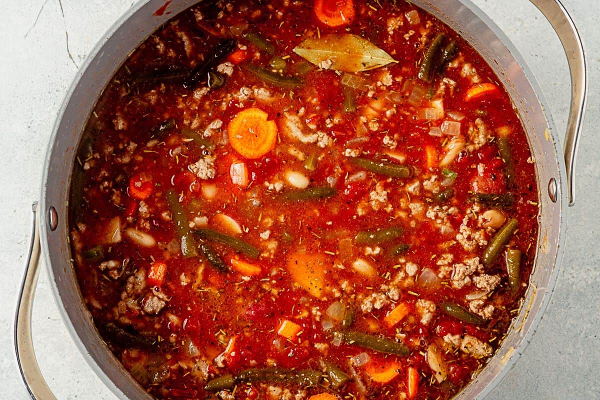 ground turkey vegetable soup in a large pot after simmering