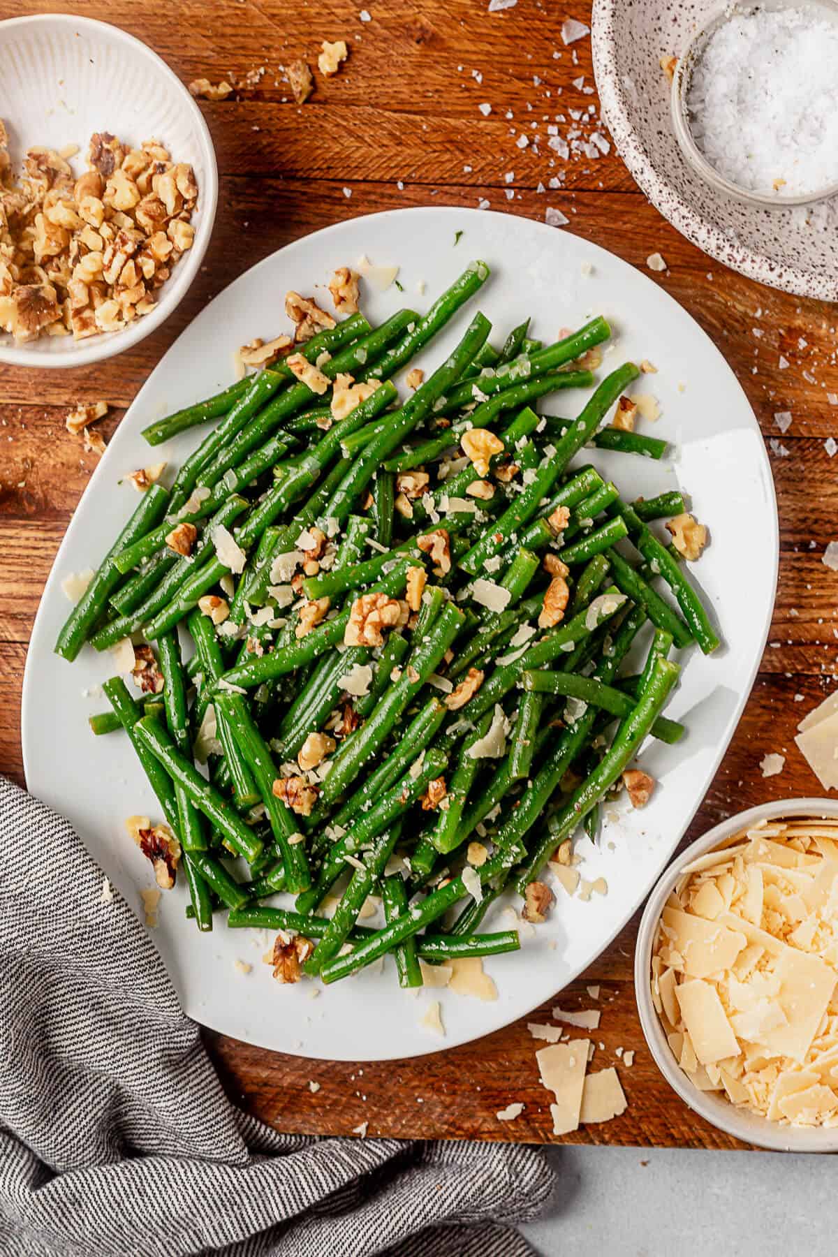 haricot verts on a serving platter sprinkled with parmesan cheese
