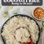 instant pot coconut rice in a bowl with a wooden spoon scooping it up