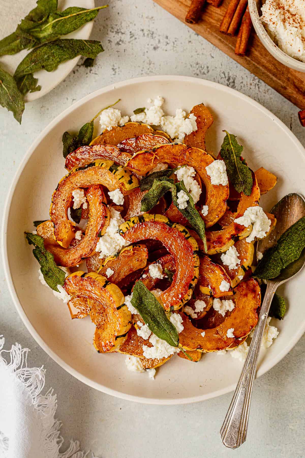 roasted delicata squash, fried, sage, and ricotta in a serving bowl