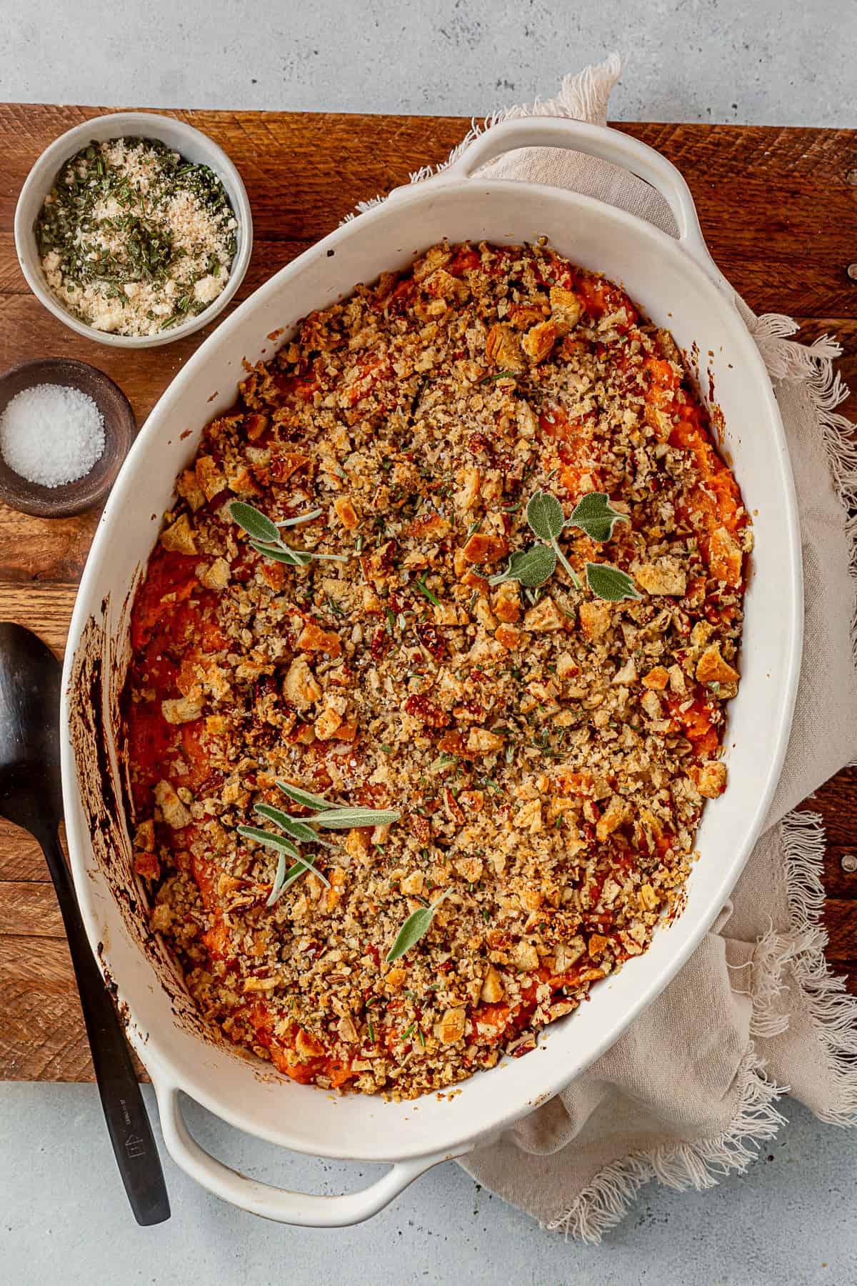 savory sweet potato casserole cooling on a serving tray.