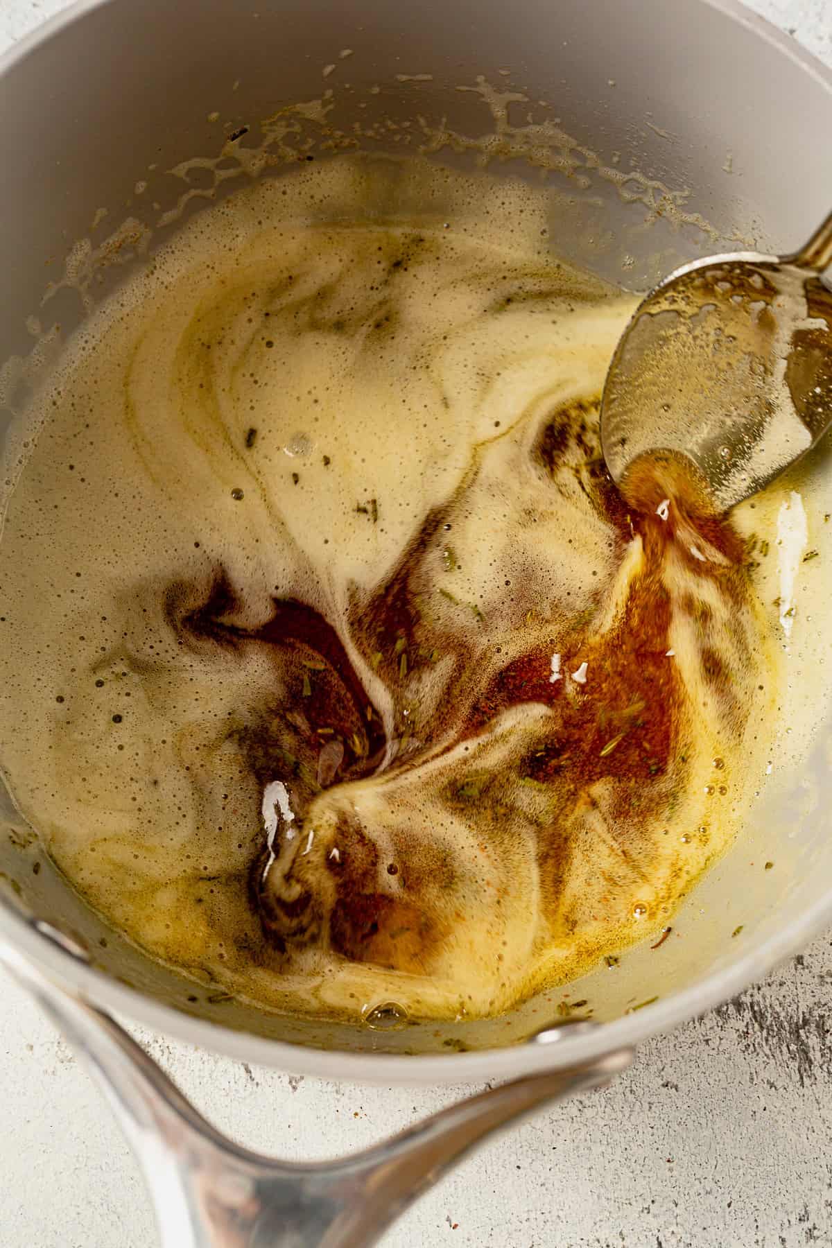 stirring brown butter in a saucepan.