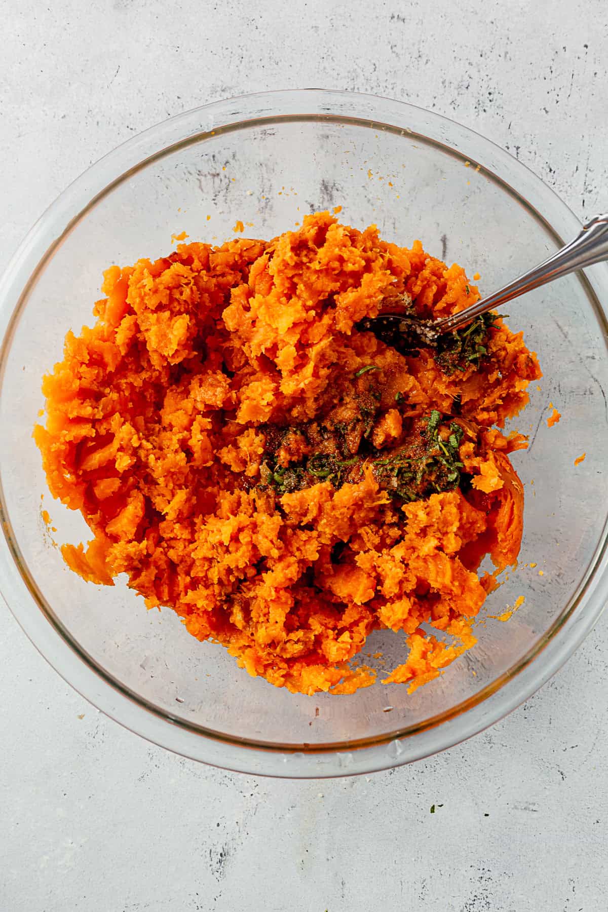 savory sweet potato casserole filling in a mixing bowl.