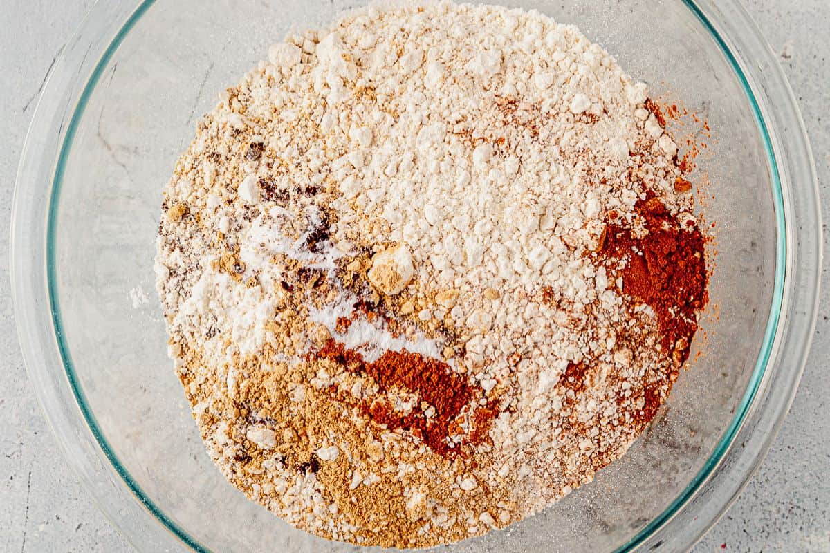 flour, baking soda, and gingerbread spices in a mixing bowl