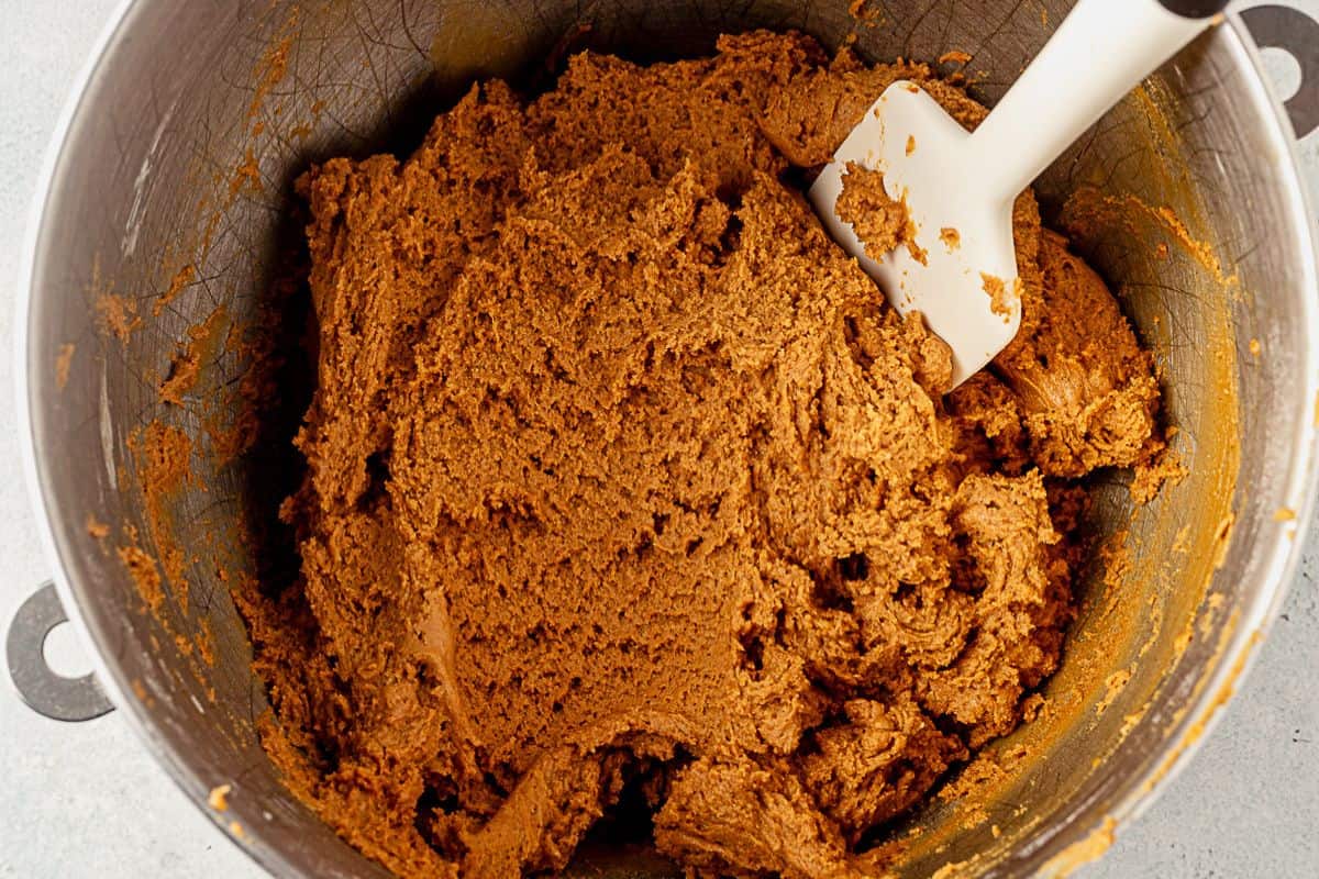 soft gingerbread cookie dough in a bowl with a spatula